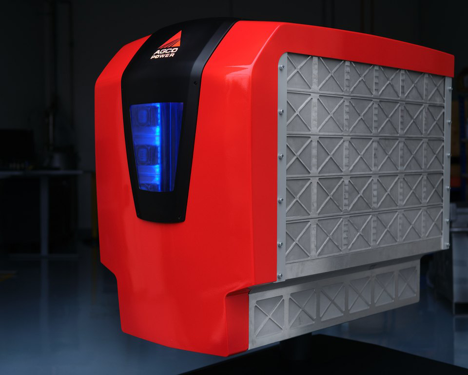 AGCO Power future technology concept unit with red casing, blue indicator light, and a large grey lattice panel
